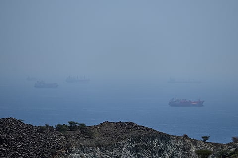 Tankers and bulk carriers anchored in the Strait of Hormuz, Saturday, April 18, 2026