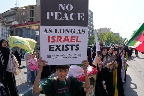Police officers stand guard at a checkpoint ahead of the second round of negotiations between the U.S. and Iran, in Islamabad, Pakistan.