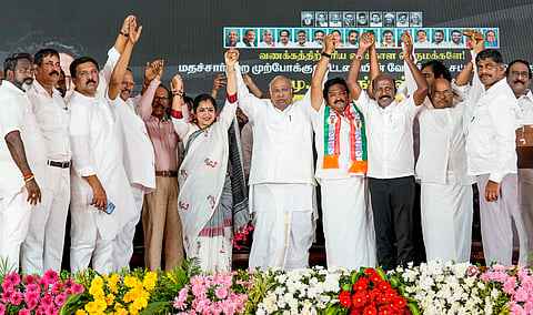 Chennai: Congress President Mallikarjun Kharge joins hands with leaders during a rally in support of party candidate from Velachery constituency, JMH Aassan Maulaana, ahead of the Tamil Nadu Assembly elections, at Thiruvanmiyur in Chennai, Tuesday, April 21, 2026. 