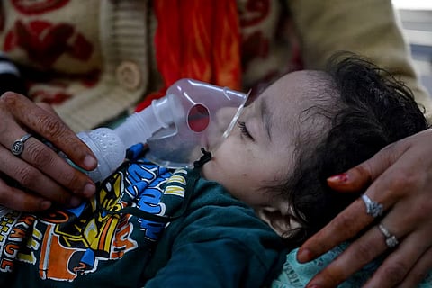 A child in a hospital in New Delhi being administered a a nebuliser session