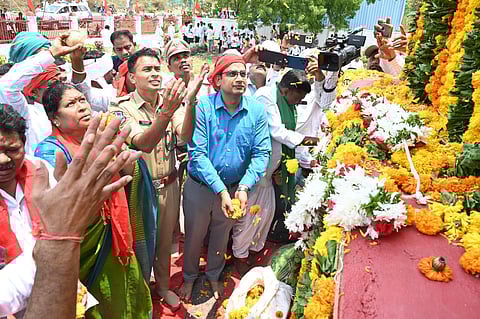 Officials, leaders and villagers pay tributes to the Indravelli Martyrs statue in Adilabad district on Monday.