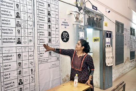 Poll staff set up the polling booth at Chennai Girls Higher Secondary School, Nungambakkam, on Wednesday in Chennai, ahead of poll day for the Assembly Elections