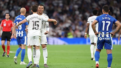 Real Madrid's Kylian Mbappe celebrates scoring his team's first goal with Arda Guler during the Spanish league football match between Real Madrid CF and Deportivo Alaves on April 21, 2026.