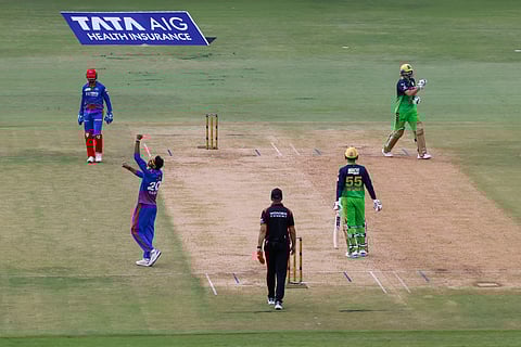 Axar Patel of Delhi Capitals celebrates the wicket of Tim David of Royal Challengers Bengaluru at M Chinnaswamy Stadium, Bengaluru