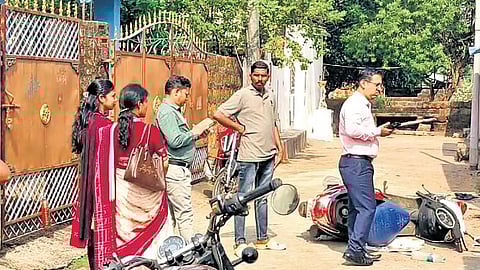 The teachers stand outside the accused’s house at Mahima Nagar 