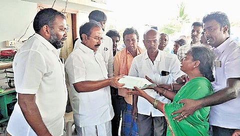Minister Rajendran hands over `5 lakh financial assistance to the family of the deceased DMK worker Mariyappan in Salem