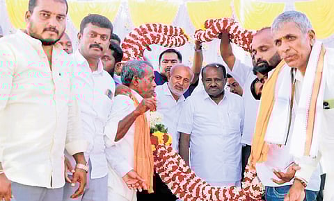 Union Minister for Heavy Industries and Steel HD Kumaraswamy being felicitated at a programme in Agrahara village of KR Nagar in Mysuru district on Friday 