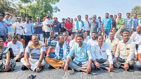 TGSRTC employees protest by blocking the road at Muthojipet following the death of K Shankar Goud in the early hours of Friday