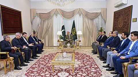 This photo released by the Pakistan Prime Minister's Office shows Iran's Foreign Minister Abbas Araghchi, fifth left, meeting with Prime Minister Shehbaz Sharif, centre.