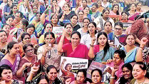 Union Minister of State Shobha Karnadlaje and Nari Shakti Forum members protest against the Congress in Bengaluru on Saturday.
