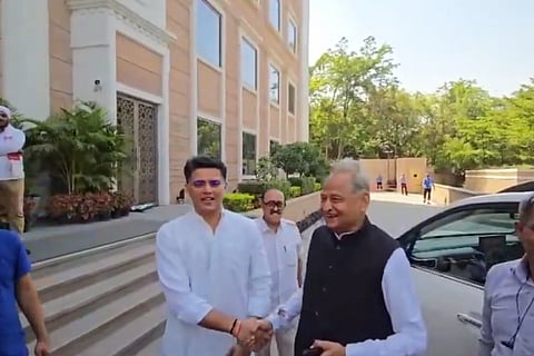 Congress leaders Ashok Gehlot and Sachin Pilot exchange a handshake.