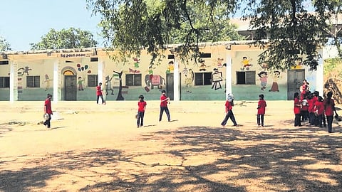 Students play in the ground at the school in Dumpalapalli village, Siddipet district.