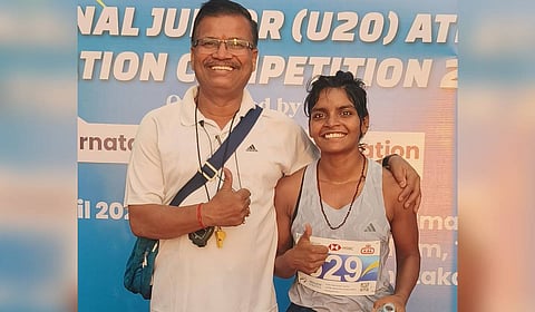 Ranjana Yadav (right) with coach Shiv Kumar Prasad (left) after winning the 5000 meters race walk gold with new national record timing at the 24th National Junior U-20 Federation Athletics in Karnataka on Saturday. 