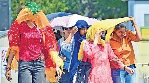 Women braving heat in Delhi. The city has seen hot days since Saturday 