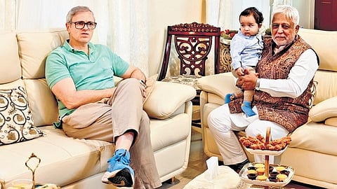J&K Chief Minister Omar Abdullah greets Aga Sultan, chairman of the Central Relief Committe, during a visit to the latter’s house in Bengaluru on Saturday.