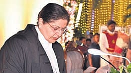 Governor S Abdul Nazeer administers the oath of office to Lisa Gill as the Chief Justice of AP High Court