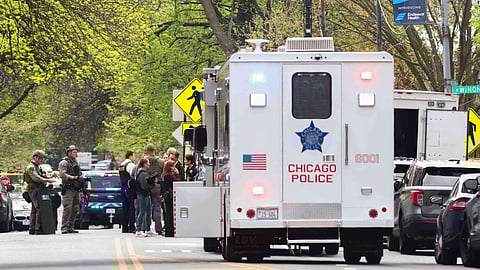 Police officers work the scene outside Endeavor Health Swedish Hospital in Lincoln Square, on Saturday, April 25, 2026. 