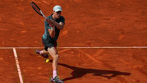 Jannik Sinner of Italy returns the ball to Benjamin Bonzi of France during the Madrid Open tennis tournament in Madrid, Friday, April 24, 2026.