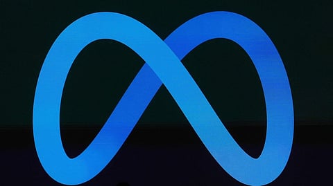 A Meta logo is shown on a video screen at LlamaCon 2025, an AI developer conference, in Menlo Park, Calif., April 29, 2025. 