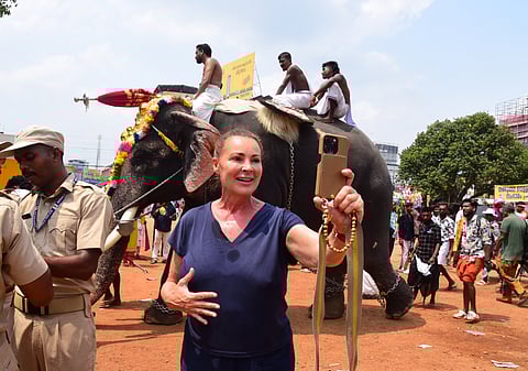 Nathalie Rous from France enjoying pooram, despite the scorching sun.