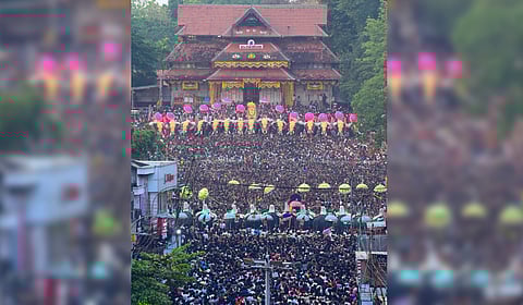 The Paramekkavu and Thiruvambady factions face off during the kudamattam ceremony as thousands witness the mesmerising sight during Thrissur Pooram on Sunday.