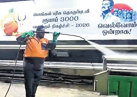A screengrab of a worker cleaning footpath and bus shelters | FILE PIC