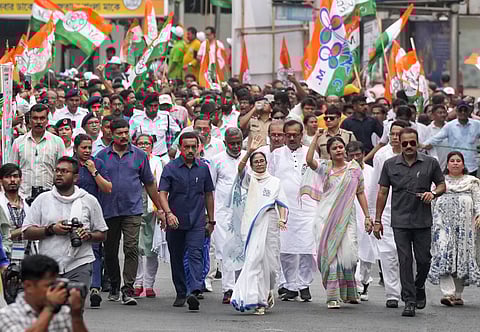 West Bengal Chief Minister and Trinamool Congress supremo Mamata Banerjee with party leaders and workers during a roadshow amid the ongoing West Bengal Assembly elections, in Kolkata, Monday, April 27, 2026. 