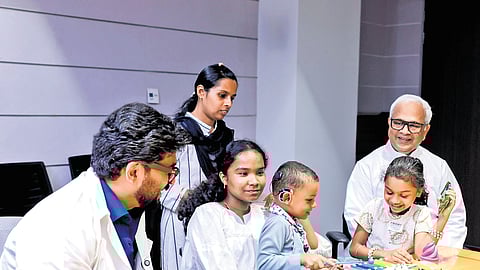 Angelo with his parents and doctors after talking to actor Mammootty