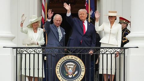President Donald Trump, first lady Melania Trump, Britain's King Charles III and Queen Camilla wave from the Blue Room Balcony during a State Visit arrival ceremony on the South Lawn of the White House, Tuesday, April 28, 2026, in Washington.