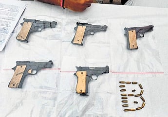 The firearms and bullets seized from the accused by police 