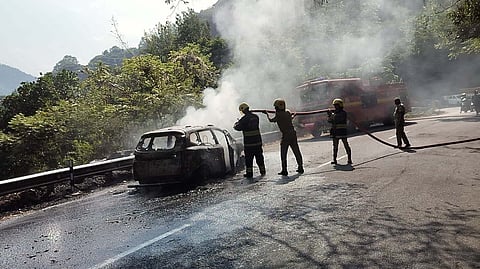A family of five members managed to escape unharmed after the car in which they were traveling on the Coonoor-Mettupalayam Ghat road caught fire near the Marapalam junction.
