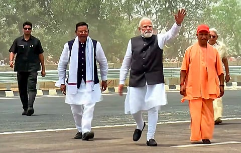 Prime Minister Narendra Modi waves to the gathering during the inauguration of the 594-km-long Ganga Expressway, in Hardoi district. Uttar Pradesh Governor Anandiben Patel and state Chief Minister Yogi Adityanath are also present.