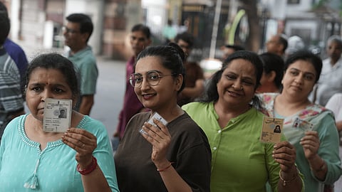 Voters wait in a queue to cast their votes during the second phase of the West Bengal Assembly elections in Kolkata on Wednesday, April 29, 2026.