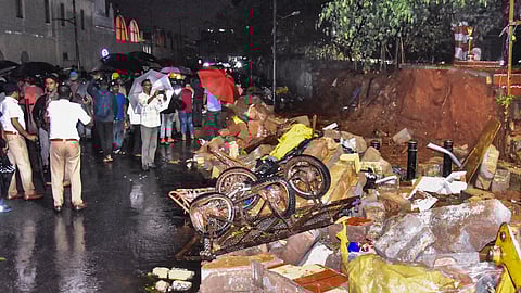  Police personnel at the site after a wall collapse following heavy rain, at Bowring Hospital, in Bengaluru, Wednesday, April 29, 2026. At least seven people were reported dead.