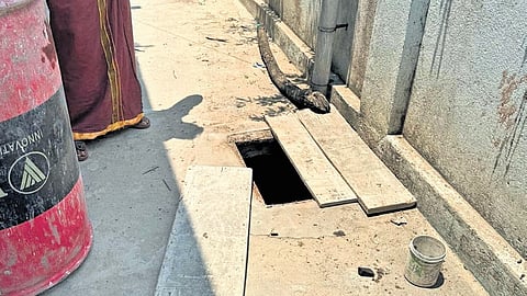 The partially covered septic tank, where the three-year-old boy fell
