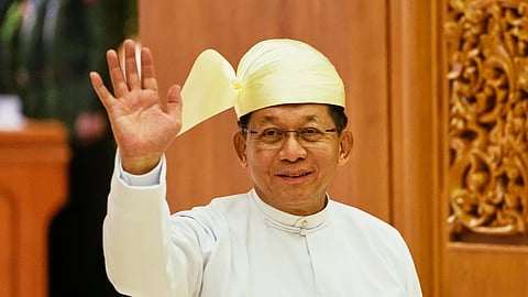 Myanmar's newly elected president and junta chief, Gen. Min Aung Hlaing, waves as he leaves Union Parliament after a swearing-in ceremony in Naypyitaw, Myanmar, Friday, April 10, 2026.