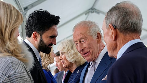 Britain's King Charles III, standing next to Queen Camilla, interacts with New York City Mayor Zohran Mamdani during a visit to the 9/11 Memorial in New York on Wednesday, April 29, 2026.