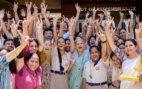 Students celebrate after the declaration of Class 10 (ICSE) and Class 12 (ISC) board examinations, at a school in Gurugram, Thursday, April 30, 2026. 