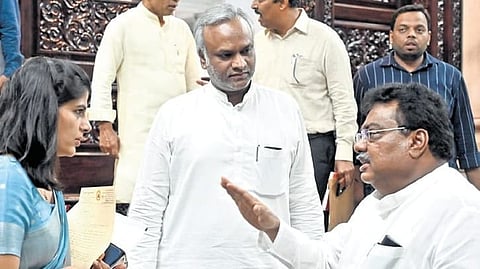 Ministers MB Patil and Priyank Kharge leave after the cabinet meeting at Vidhana Soudha in Bengaluru on Thursday.
