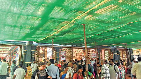Authorities of Kanaka Durga temple set up shade nets atop Indrakeeladri Hill in Vijayawada, on Thursday, to protect devotees from scorching heat.