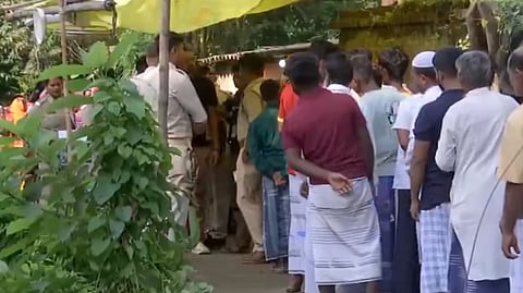 Voters queue outside a polling station during a repoll in Diamond Harbour constituency, South 24 Parganas district, on May 2, 2026.