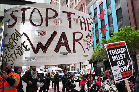 People march during a May Day rally in Chicago, Friday, May 1, 2026. 
