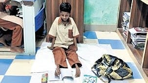  Laxmi Khemudu, a Class X student writing her exam with her feet.