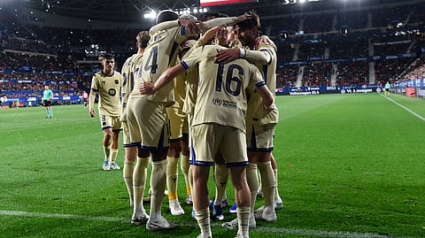 Barcelona's Spanish forward #07 Ferran Torres (R) celebrates scoring his team's second goal during the Spanish league football match between CA Osasuna and FC Barcelona at El Sadar Stadium in Pamplona on May 2, 2026.