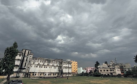 Dark clouds hover on the skyline at Bajrakabati road just before nor’wester rains, in Cuttack on Saturday 