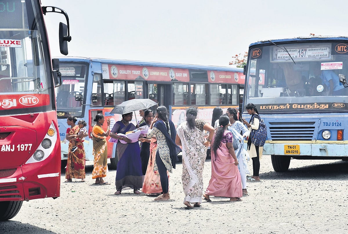 Bereft of cover, people face the elements at Redhills bus stand