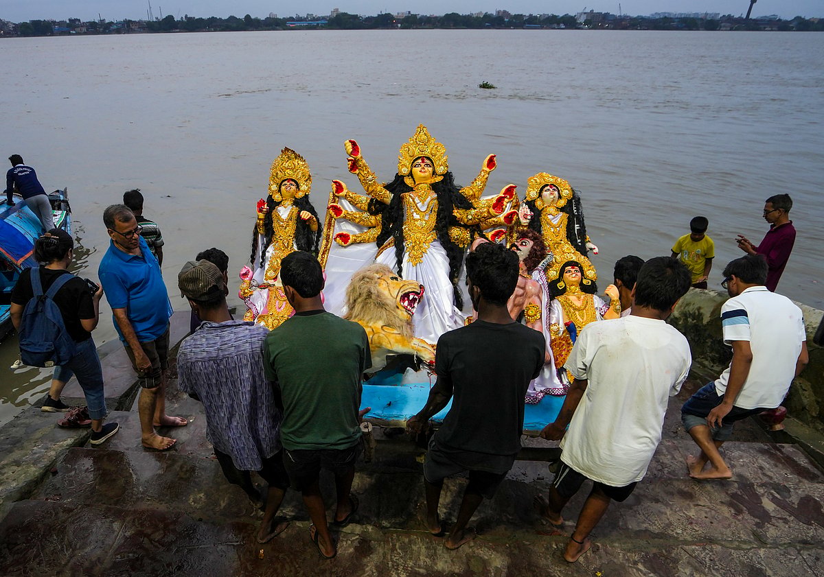 Durga idol immersion on the Hooghly River in Kolkata